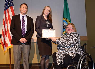 Tami receiving a nomination for the WA State Governor's Committee on Disability Issues and Employment's Direct Support Professional of the Year