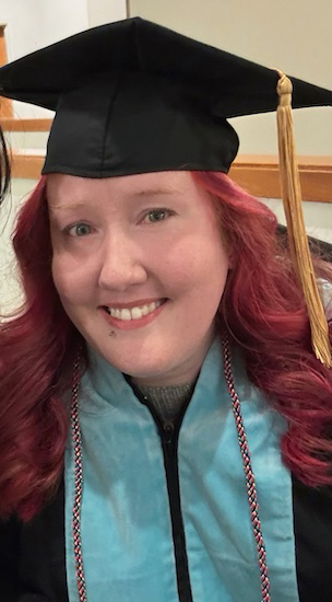 Kayla Brown in her doctoral graduatate cap and gown.
