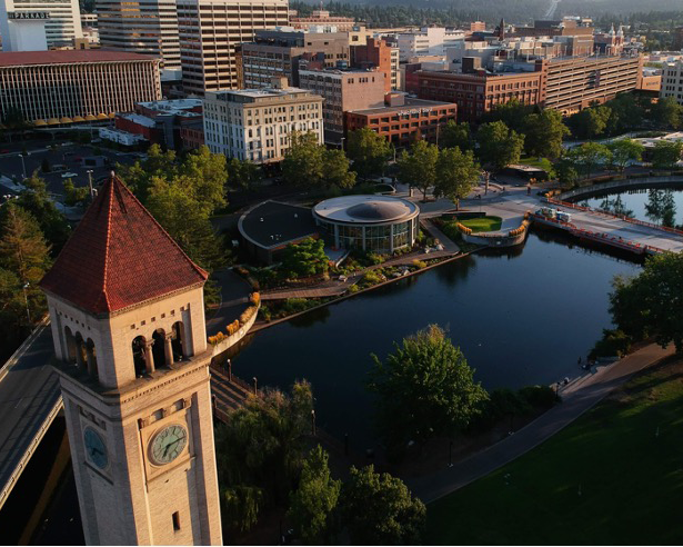 Bird's eye view of Spokane, featuring a clock tower and a park
