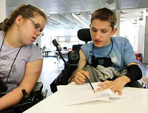 Two people working on a chair