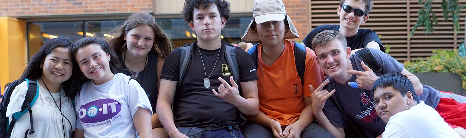 Students with a variety of disabilities smiling for the camera.