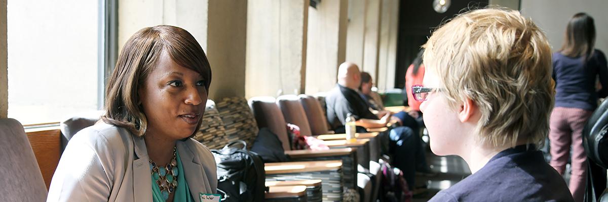 A student talking to a teacher