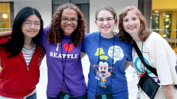 A group of students smiling and standing together.